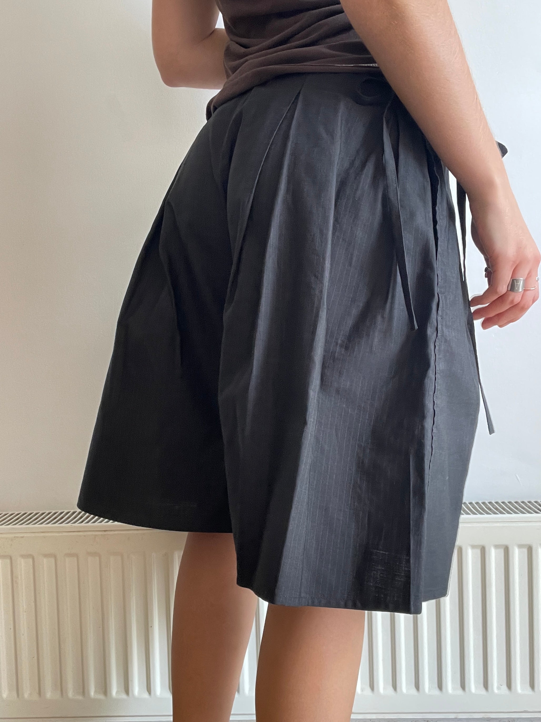 handmade pleated black pinstripe baggy shorts with pockets