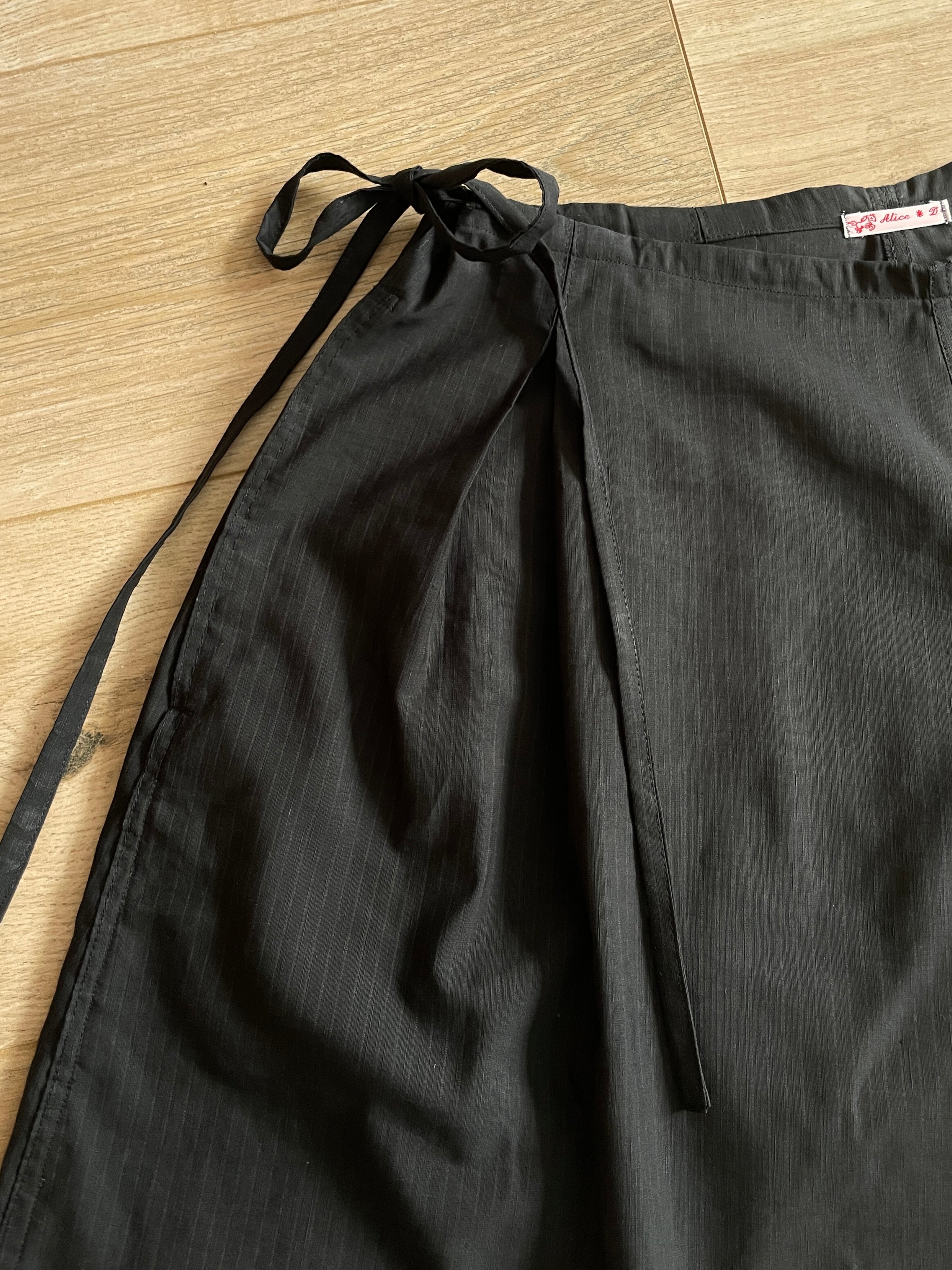 handmade pleated black pinstripe baggy shorts with pockets