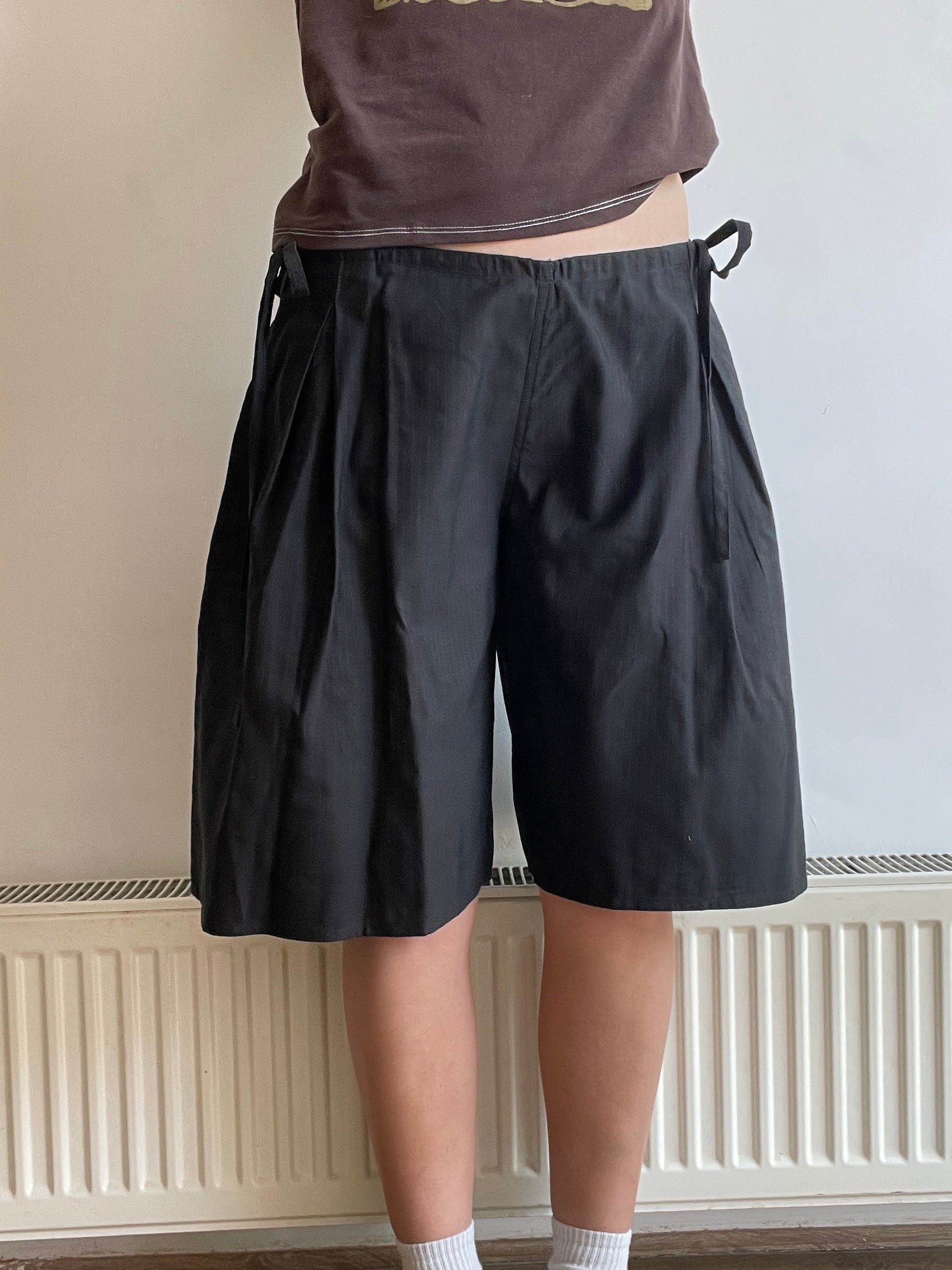 handmade pleated black pinstripe baggy shorts with pockets