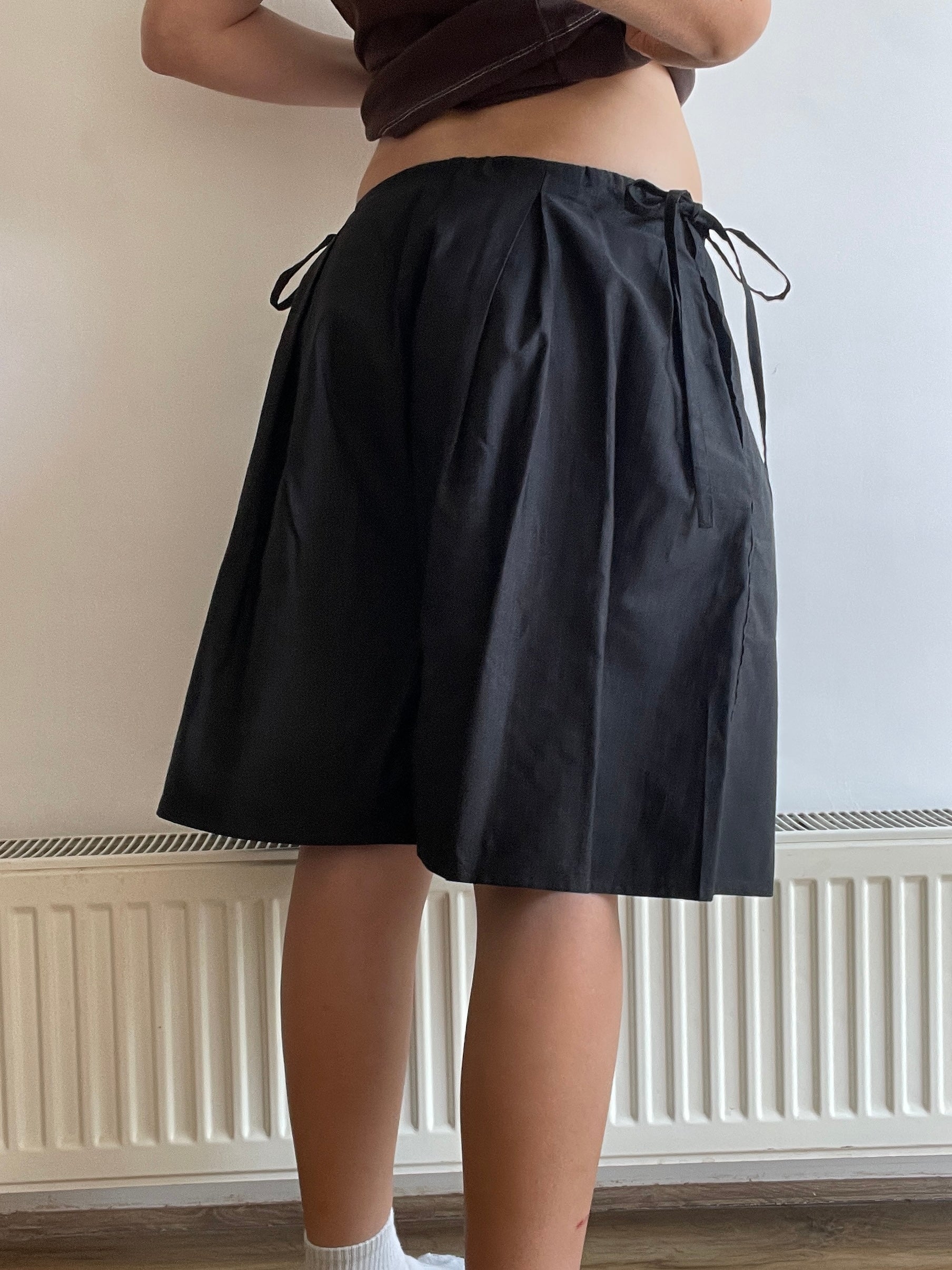 handmade pleated black pinstripe baggy shorts with pockets