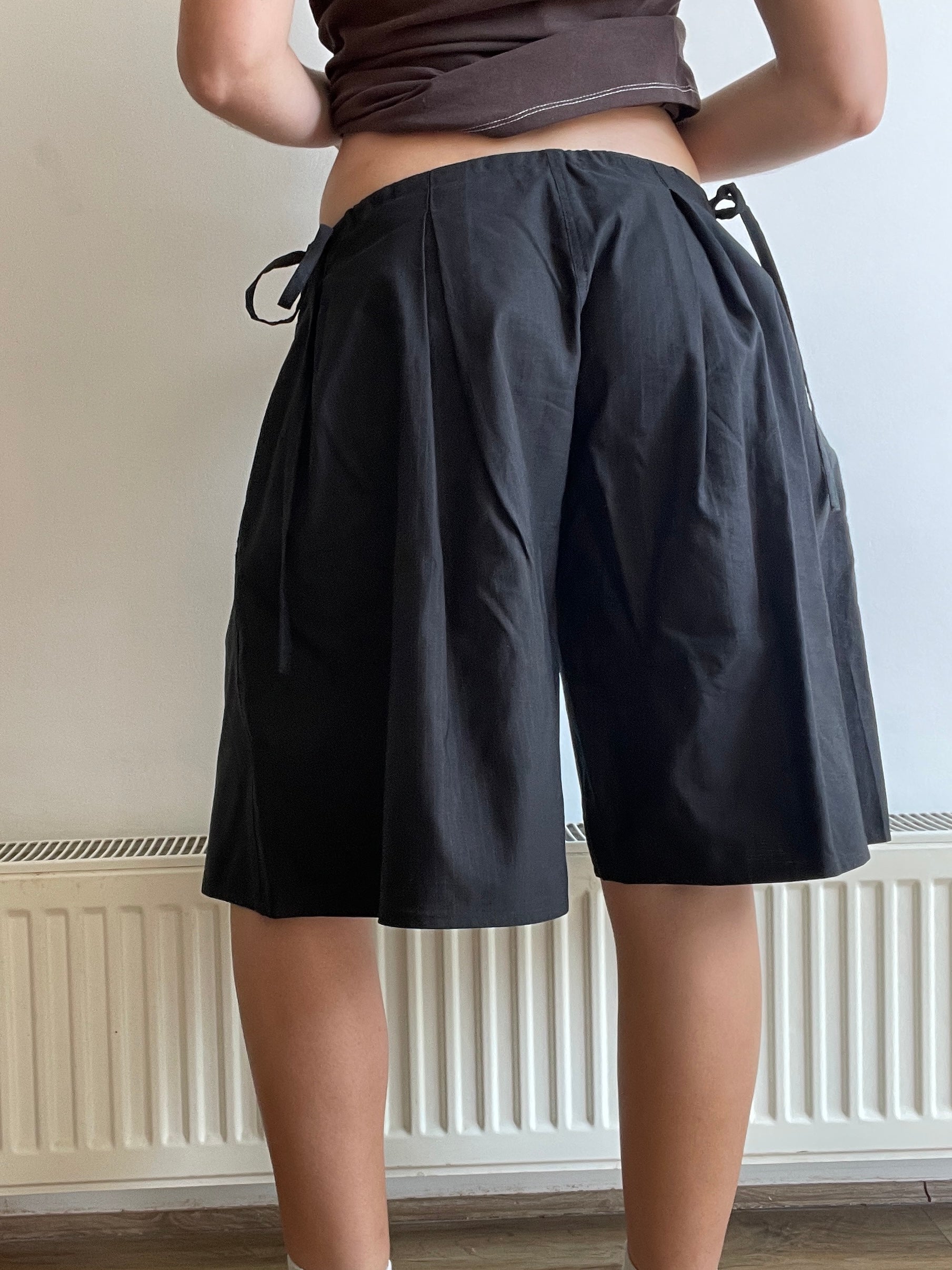 handmade pleated black pinstripe baggy shorts with pockets
