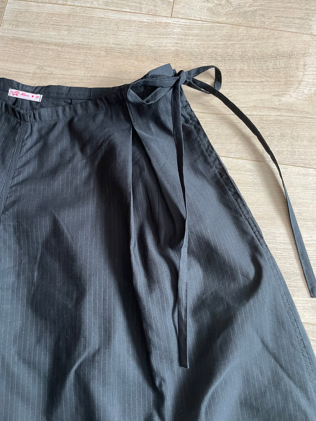 handmade pleated black pinstripe baggy shorts with pockets