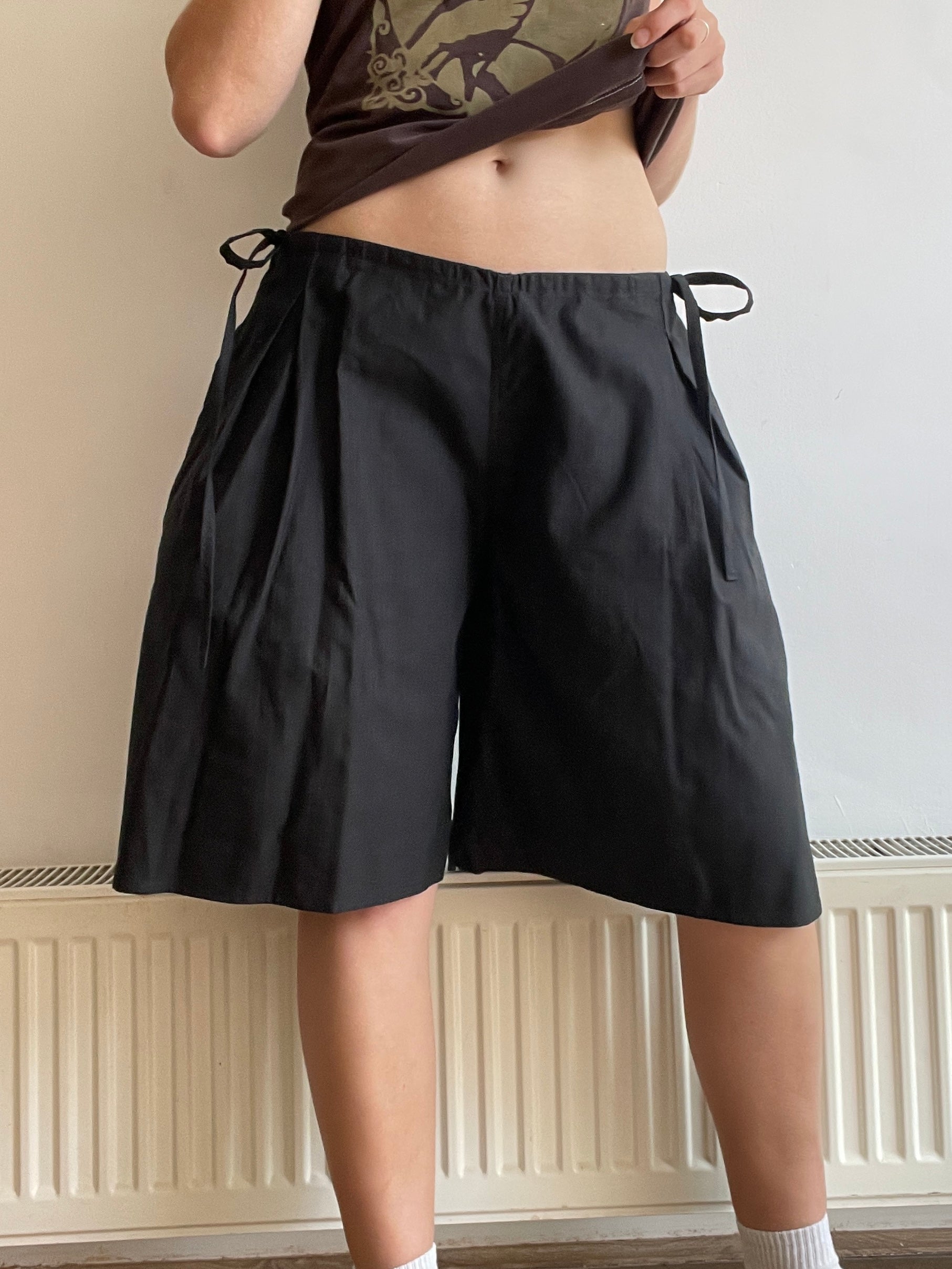 handmade pleated black pinstripe baggy shorts with pockets