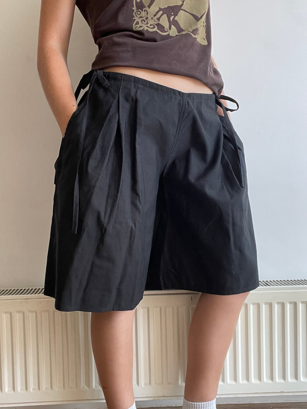 handmade pleated black pinstripe baggy shorts with pockets