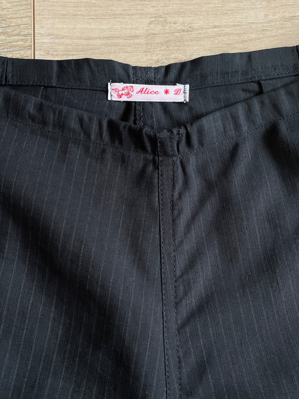 handmade pleated black pinstripe baggy shorts with pockets