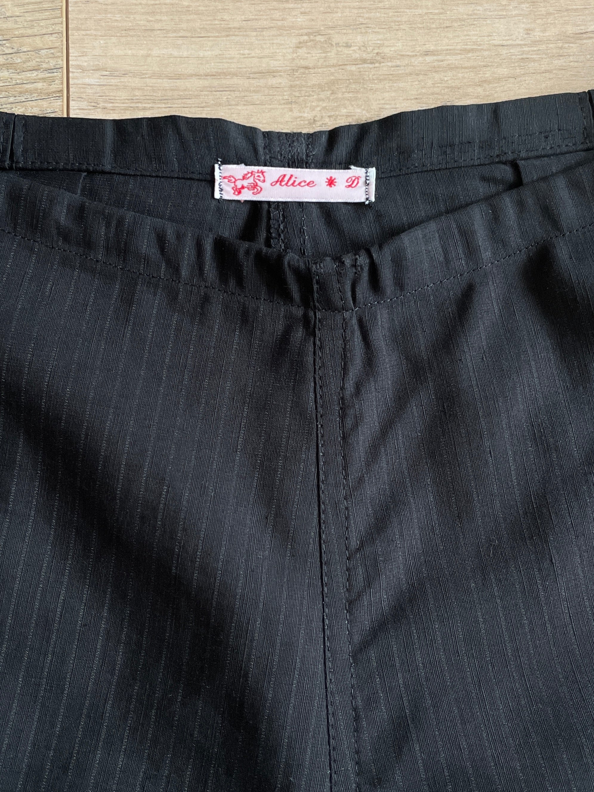 handmade pleated black pinstripe baggy shorts with pockets