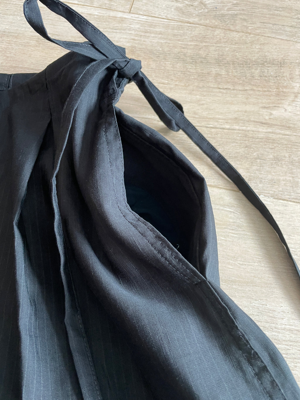 handmade pleated black pinstripe baggy shorts with pockets