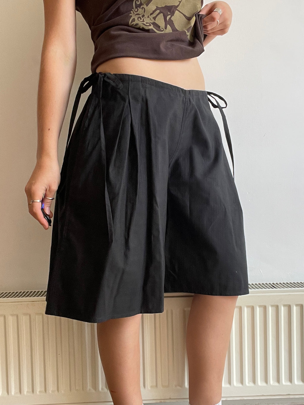 handmade pleated black pinstripe baggy shorts with pockets