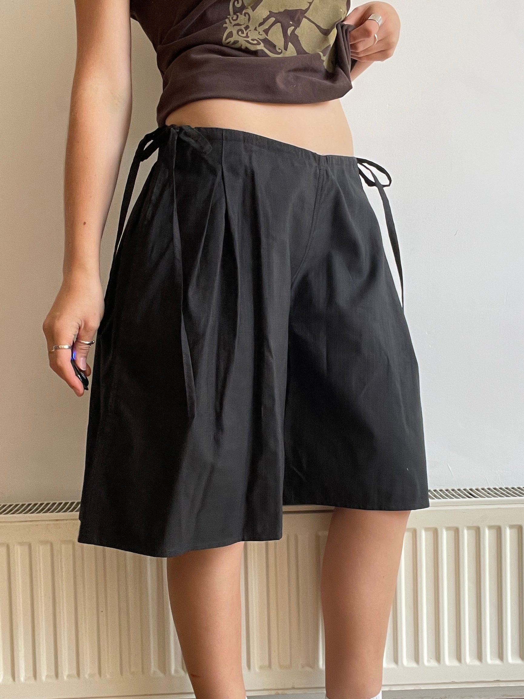 handmade pleated black pinstripe baggy shorts with pockets