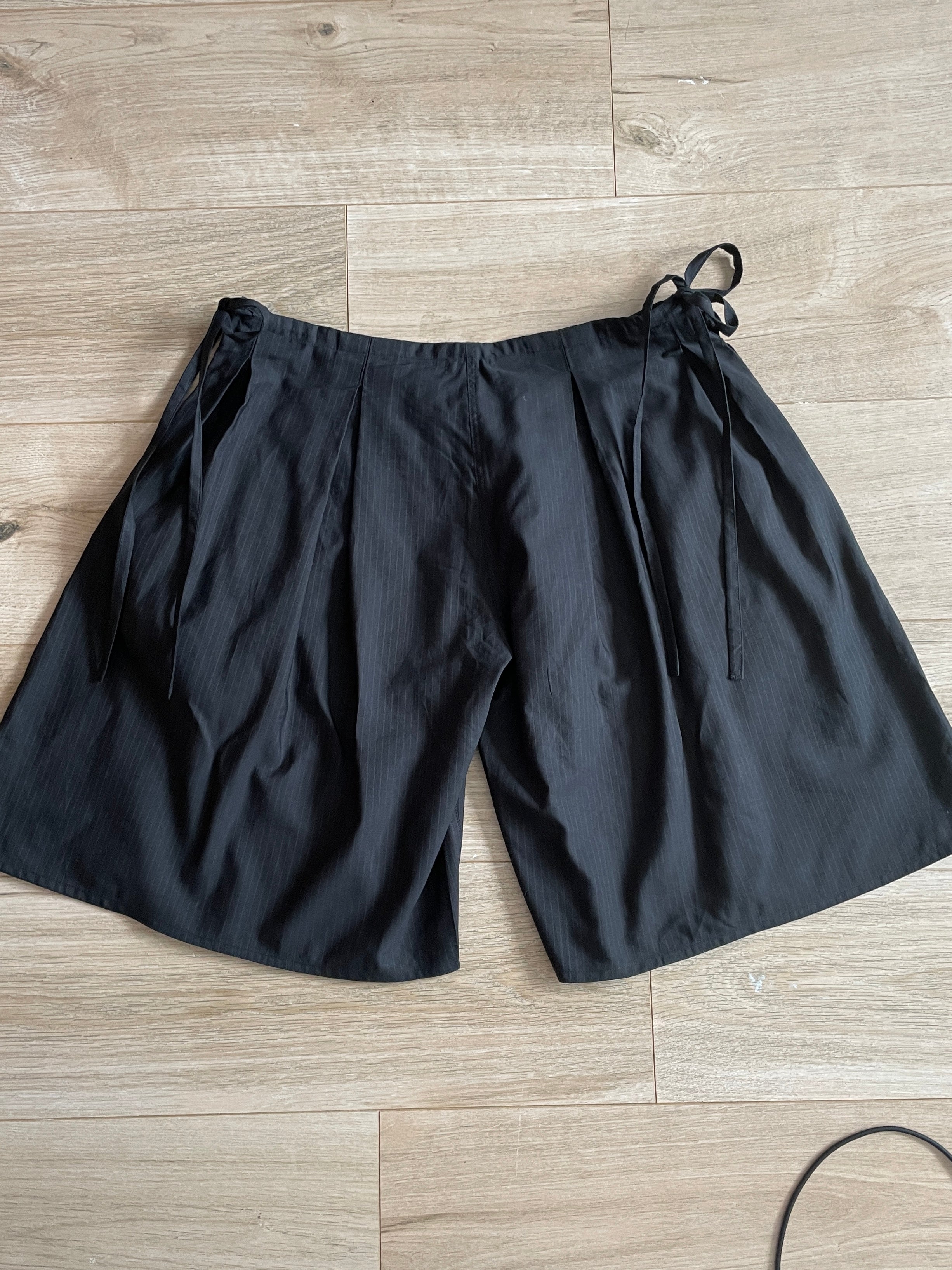 handmade pleated black pinstripe baggy shorts with pockets