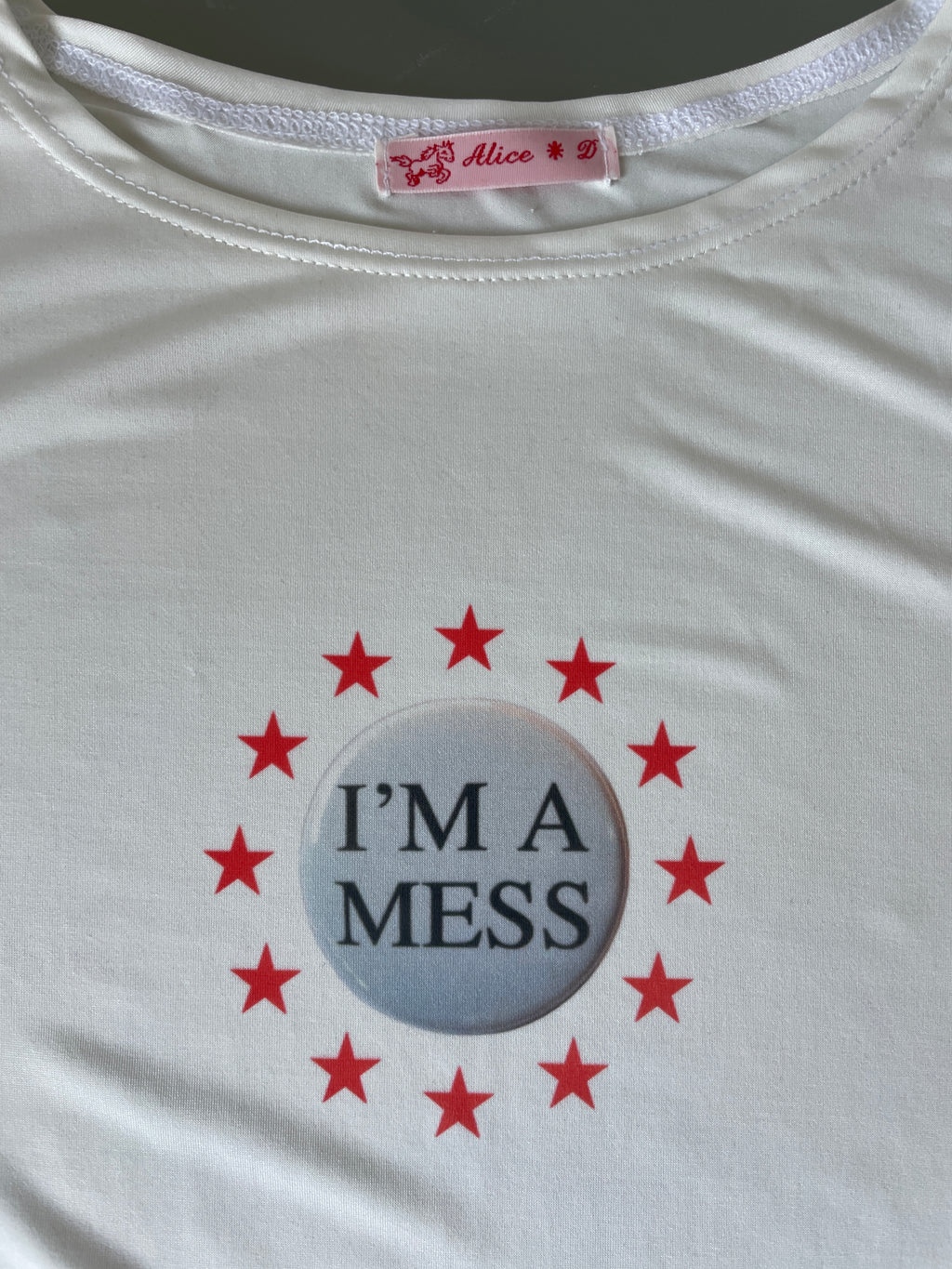 handmade slinky witty badge slogan mess baby tee