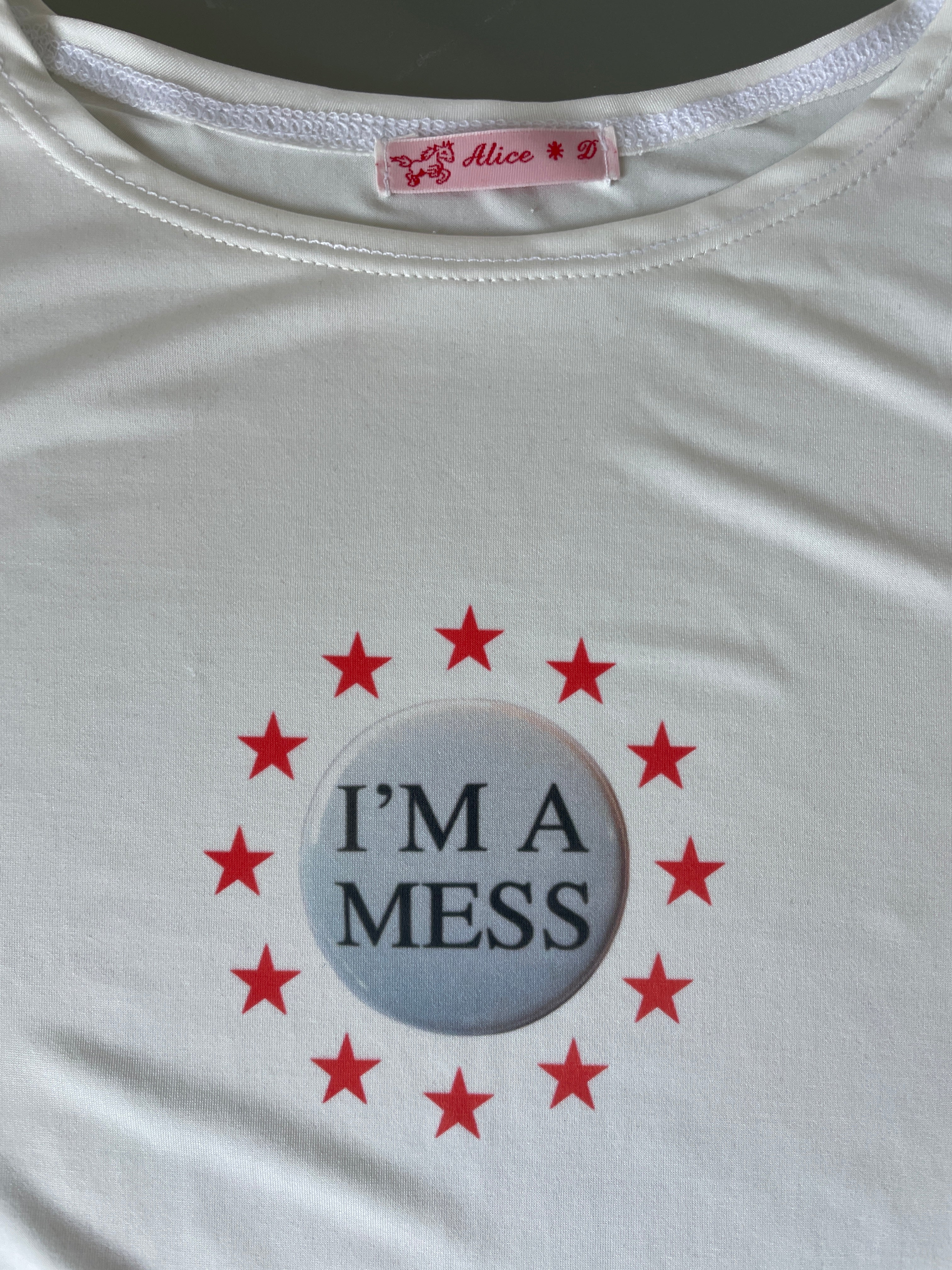 handmade slinky witty badge slogan mess baby tee