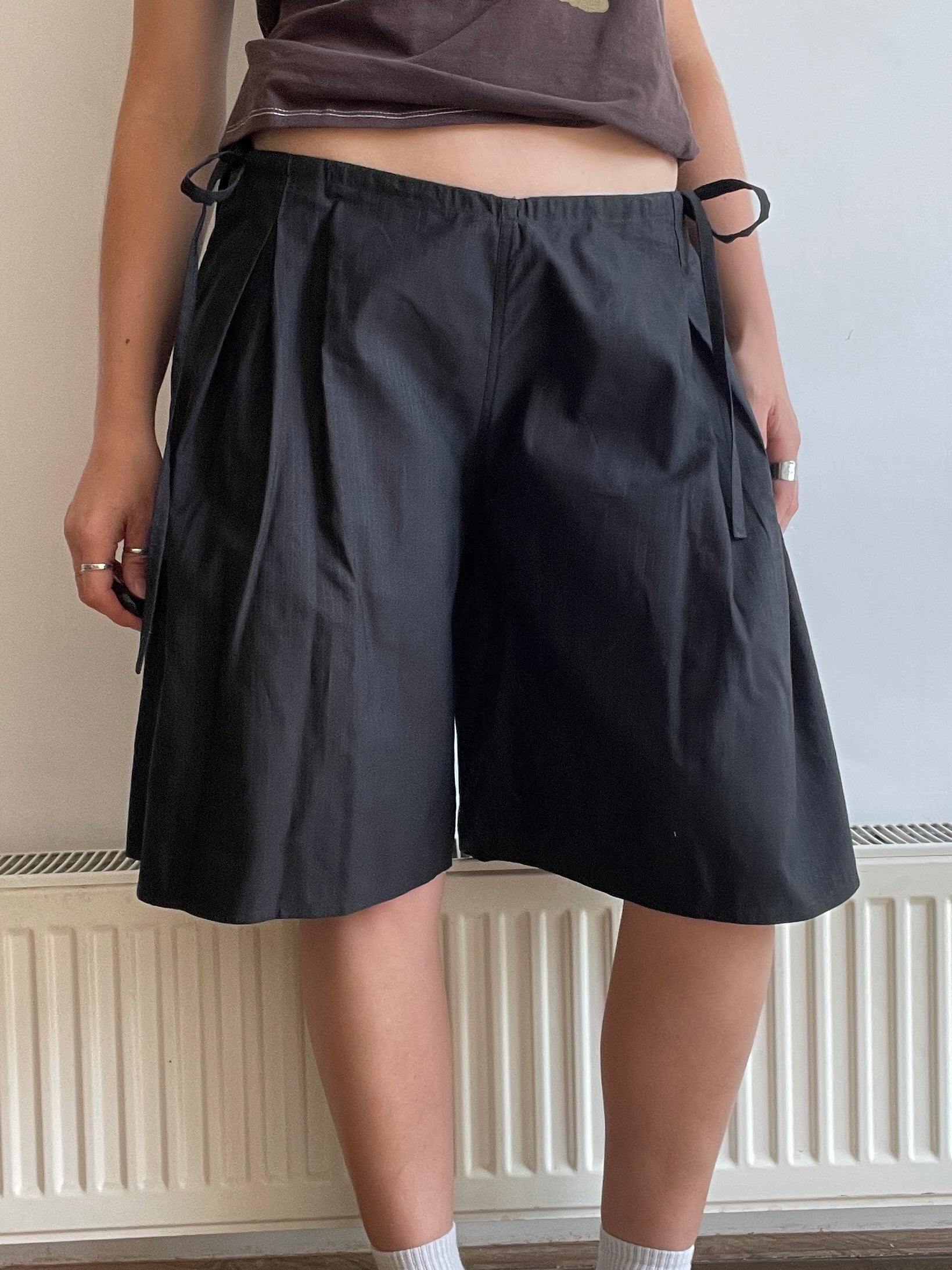handmade pleated black pinstripe baggy shorts with pockets
