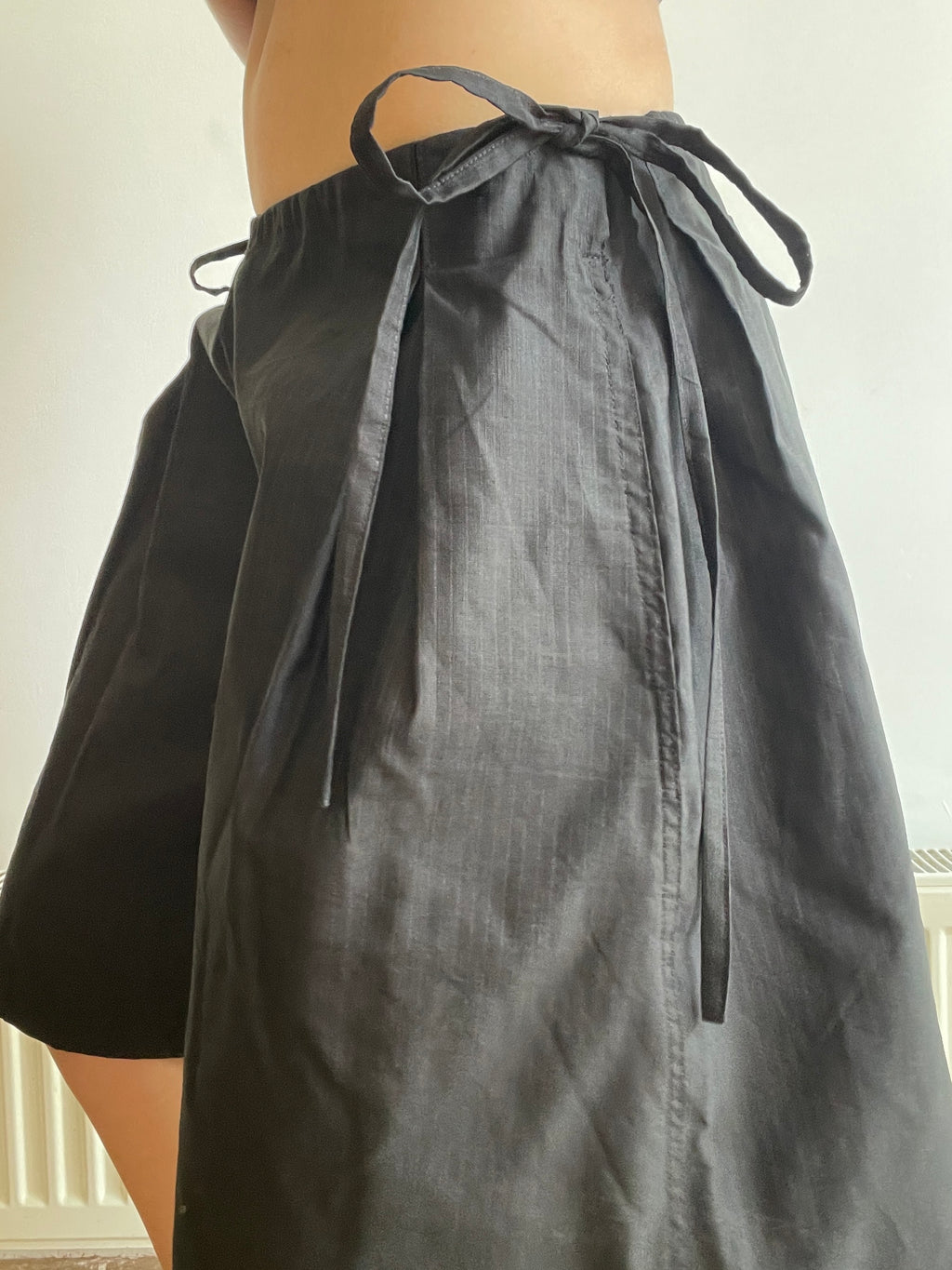handmade pleated black pinstripe baggy shorts with pockets