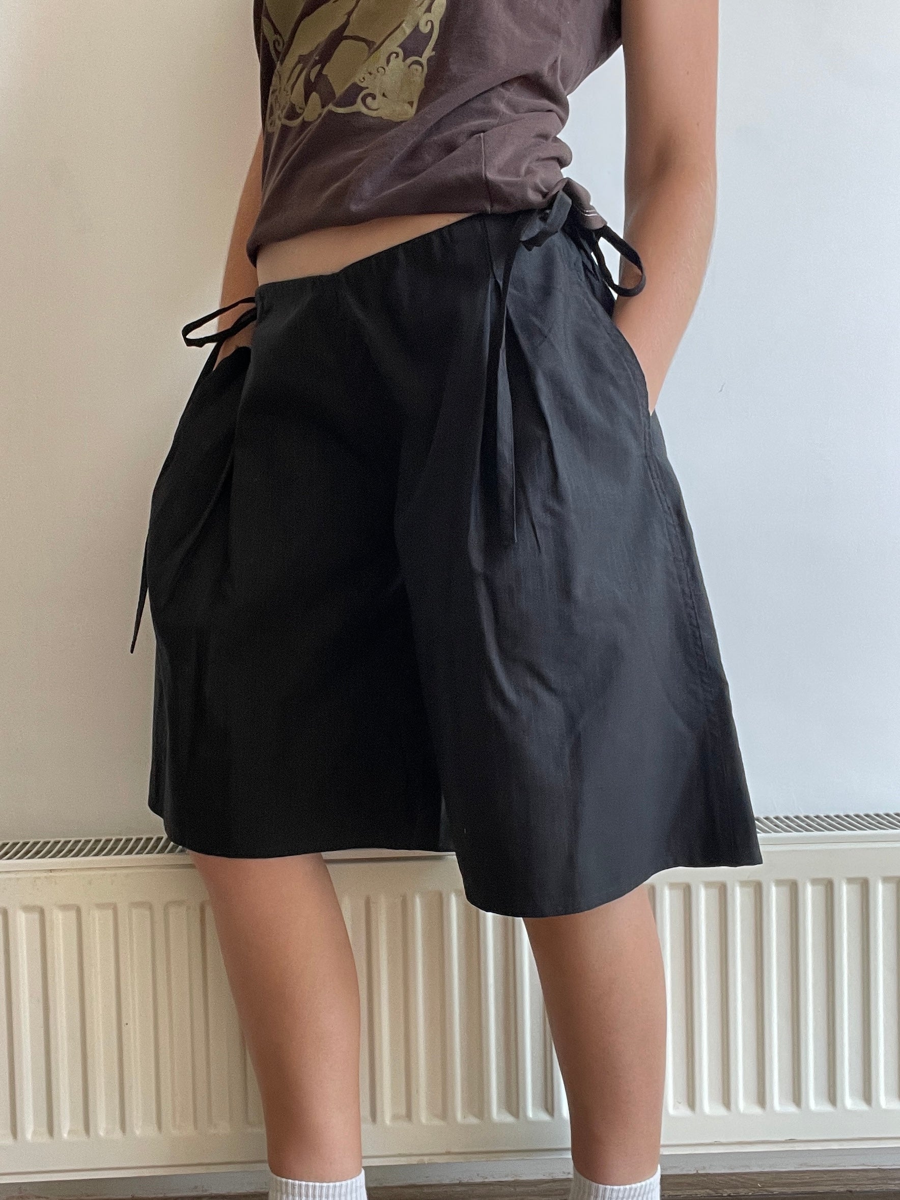 handmade pleated black pinstripe baggy shorts with pockets